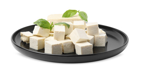 Plate with delicious tofu cheese and basil isolated on white