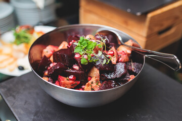 Catering table, beautifully decorated banquet with variety of with different food snacks appetizers on corporate birthday party event or wedding celebration, canape, salad, delicatessen setting