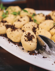 Catering table, beautifully decorated banquet with variety of with different food snacks appetizers on corporate birthday party event or wedding celebration, canape, salad, delicatessen setting