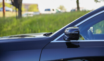 Plakat Car side mirror represents reflection, awareness, safety, and the visual extension of the driver's field of view