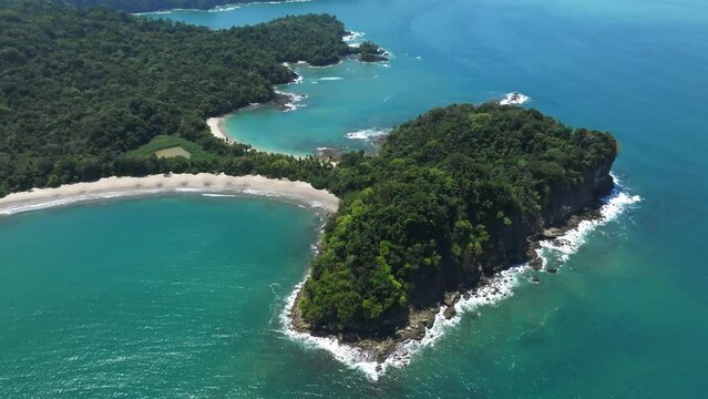 Aerial view of Manuel Antonio National Park in Costa Rica. The best Tourist Attraction and Nature Reserve with lots of Wildlife, Tropical Plants and paradisiacal Beaches on the Pacific Coast.