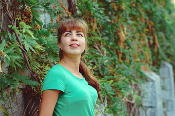 beautiful girl in the branches of vines