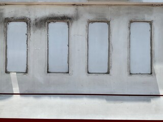 The windows on old wall .it pattern of Thailand street photo. Background space use put text or document 