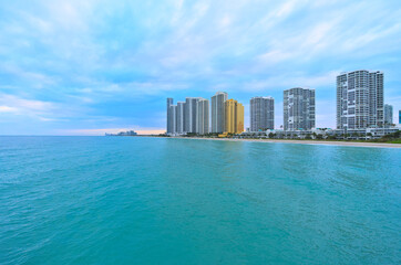 View of Sunny Isles Beach from the pier during cloudy winter eveninf (Florida, USA)