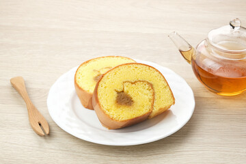 Bolu Gulung Nanas or Slice Pineapple Roll Cake served on white plate
