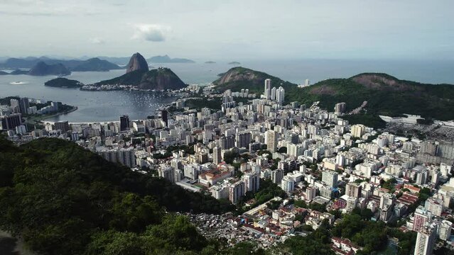 Aerial view over people at the Mirante Dona Marta viewpoint, revealing the downtown Rio de Janeiro, Brazil