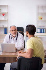 Young male patient visiting old male doctor