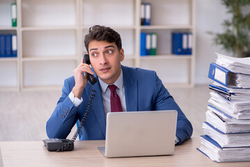 Young male employee working in the office