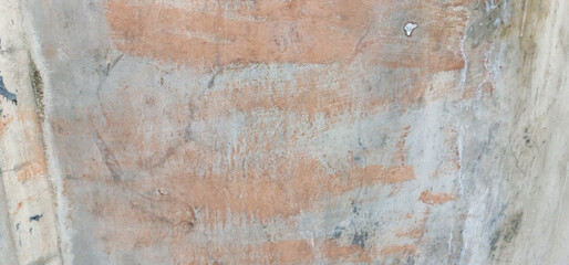 The texture of the gray cement wall on a gray background, taken at close range