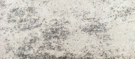 The texture of the gray cement wall on a gray background, taken at close range