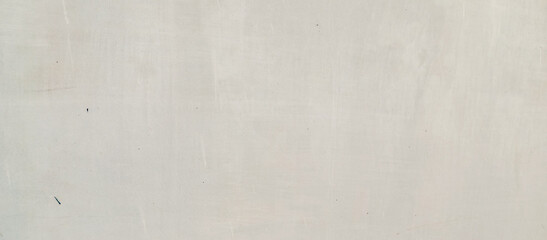 The texture of the gray cement wall on a gray background, taken at close range