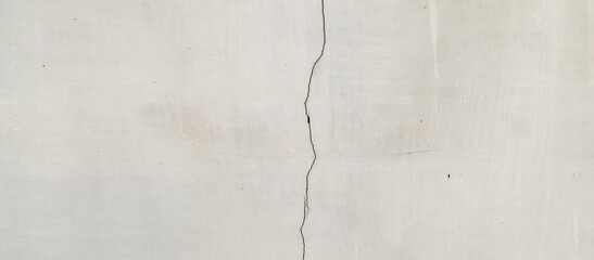 The texture of the gray cement wall on a gray background, taken at close range