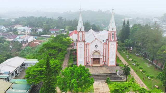 Small parish church near Bao Loc, Vietnam on a foggy morning, a place for parishioners to come to confession and pray for peace for their families