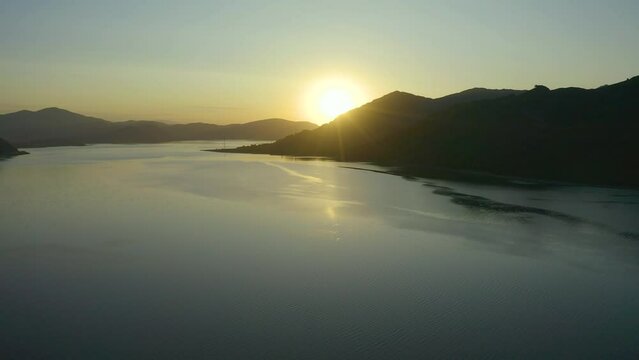 aerial sunset sun over a lake with mountains, beautiful nature of east kazakhstan, Bukhtarma reservoir,