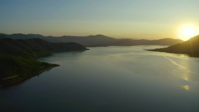 aerial sunset sun over a lake with mountains, beautiful nature of east kazakhstan, Bukhtarma reservoir,