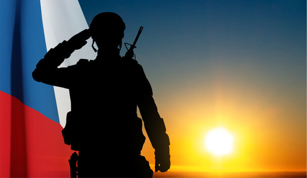 Silhouette of a sakuting soldier agianst the sunset with Czech flag. EPS10 vector