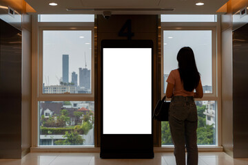 Mock up large blank vertical light box between wrist watch shop and elevator in modern building,...