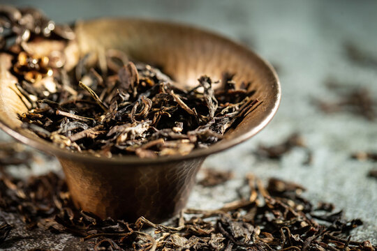 tea utensils and dried leaf tea