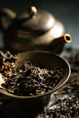 tea utensils and dried leaf tea	