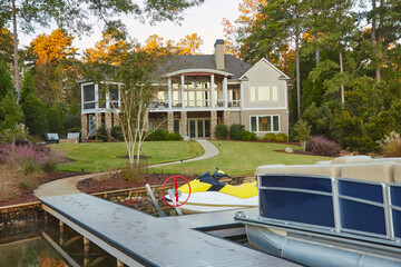 House on a beautiful lake in Georgia with boats docked and ready for fun activities