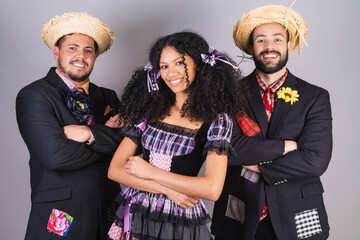 friends wearing typical clothes of festa junina, arraial, festa de são joão. crossed arms.