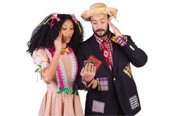 Couple wearing typical clothes of Festa Junina, Arraial, Festa de São João. holding smartphone.