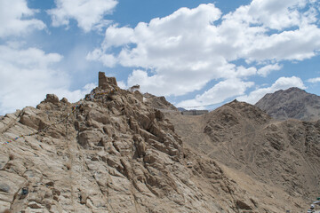 The barren landscape of Leh, Ladakh. Landscape view of rocky land surrounded by Himalayas Dramatic...