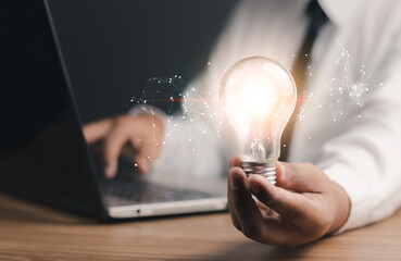 Creative thinking ideas and innovation technology, inspiration concept. Businessman holding light bulb,Idea and imagination,Solution analysis and development network connection.