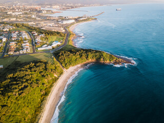 Aerial view of calm beach located at Fisherman's beach, Port Kembla, NSW, Australia