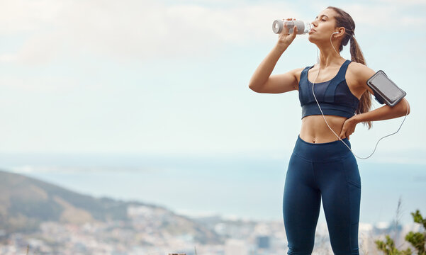 Fitness, relax, woman with drinking water and hiking in nature mockup for health and wellness during exercise. Music, bottle and fit girl on hike in park with phone, earphones and radio or podcast.