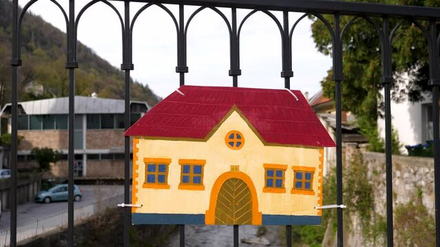 A painted fragment of a house attached to a bridge in the center of the old town of Trzic, Slovenia