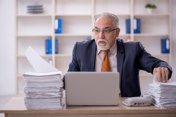 Old male employee and too much work in the office