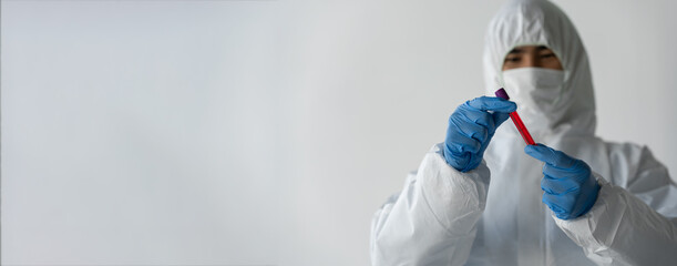 copy space, banner, panorama Health technician holding blood vessels in clinical laboratory for medical analysis Pharmaceutical and scientific research and development ideas.