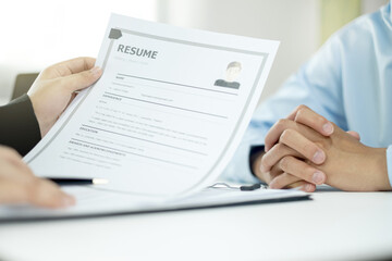 Businesswoman HR Managers people hold a resume and talk to job applicants for job interviews about careers and Their personal history in the company. Employment and Recruitment concepts
