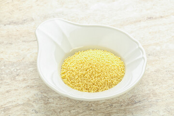 Raw couscous in the bowl