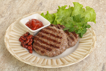 Grilled beef burger cutlet with sauce