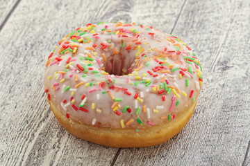 Sweet glazed vanilla donut with icing