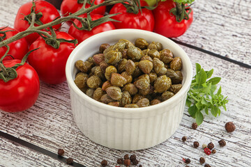 Marinated green capers in the bowl