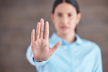 Stop, hand sign and woman with no gesture for sexual harassment and violence in workplace. Business...