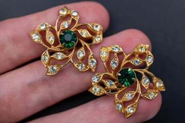 Vintage flower earrings close up, retro jewelry concept, promotional photo for an online jewelry store