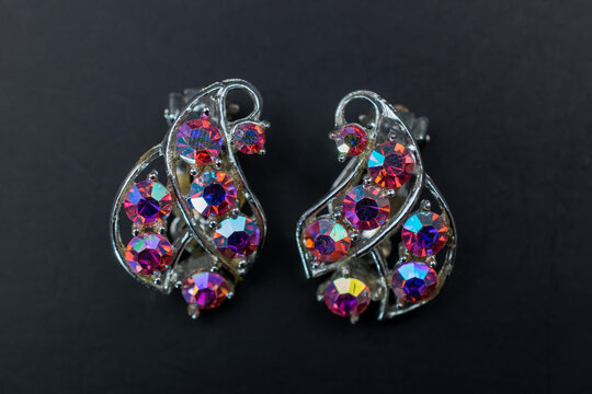 Vintage rhinestone earrings close up, retro jewelry concept, promotional photo for an online jewelry store