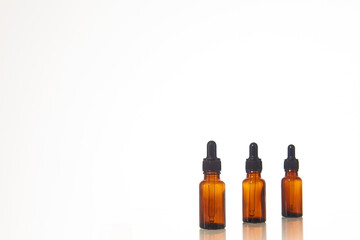 Serum dropper bottle on white background