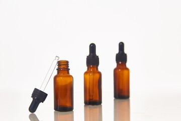 Serum dropper bottle on white background
