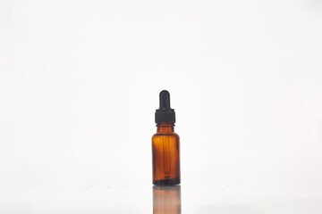 Serum dropper bottle on white background