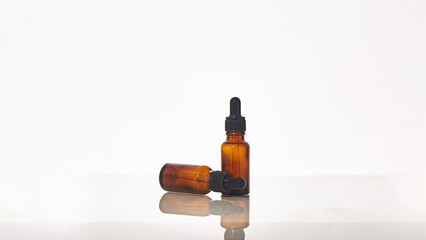 Serum dropper bottle on white background