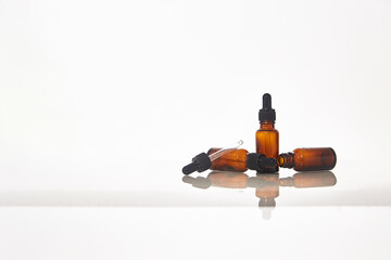 Serum dropper bottle on white background