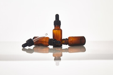 Serum dropper bottle on white background