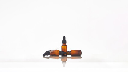 Serum dropper bottle on white background