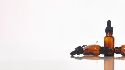 Serum dropper bottle on white background