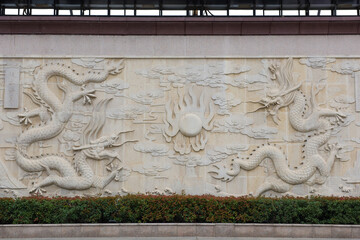 chinese dragon carving in a wall. dragon's relief : chinese royal totem